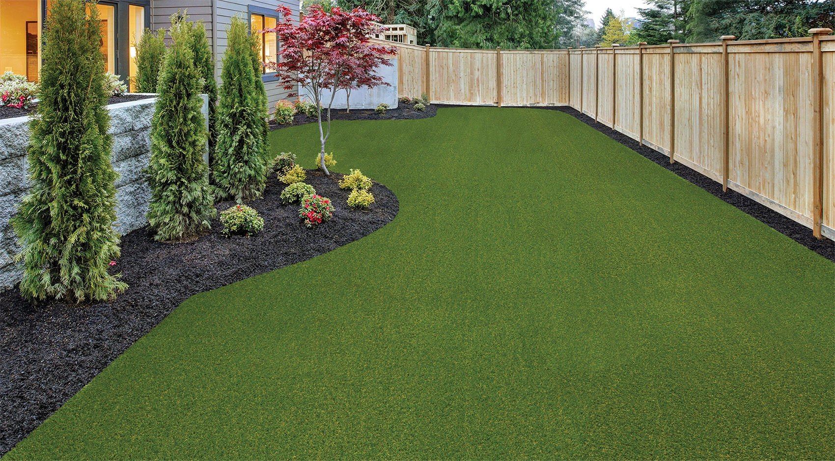 Example of artificial turf on a home lawn by Georgia Landscape Design